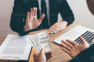 businessperson-refusing-bribe-given-money-by-partner-with-anti-bribery-corruption-concept-photo-scaled