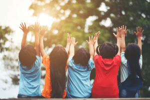 group-kids-friends-arm-around-sitting-together_1150-3907