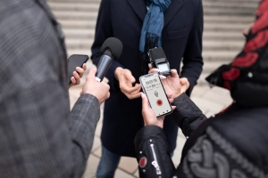 close-up-reporter-taking-interview_23-2149183577